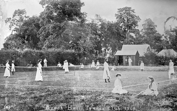 Girls playing and watching tennis